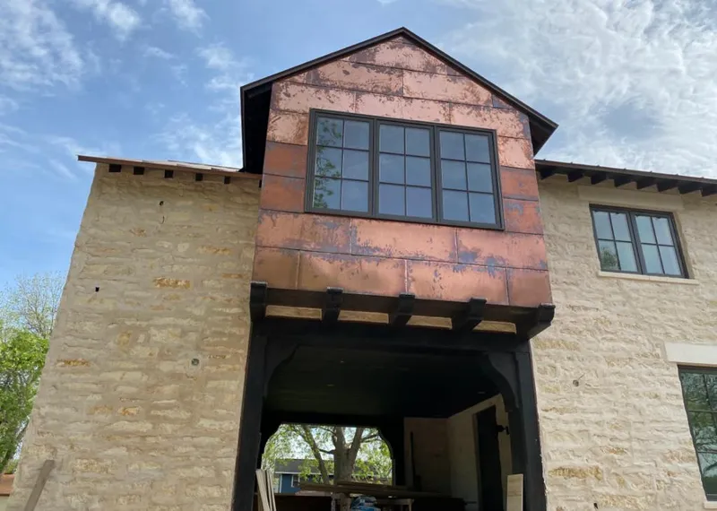 Copper metal panel facade on a stone building for Metal Roof Coating in Torrance