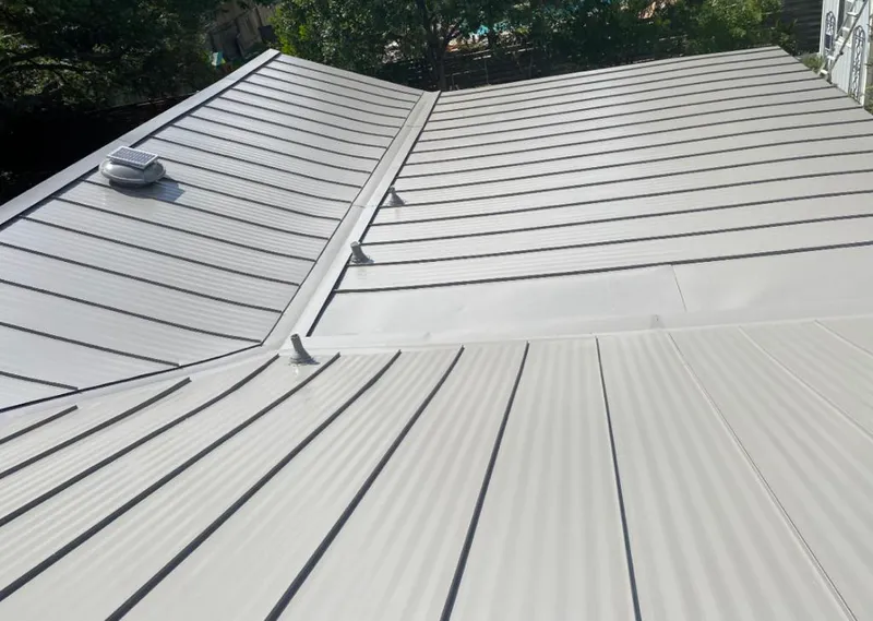Solar attic fan installed on a metal roof for Roof Ventilation in Torrance
